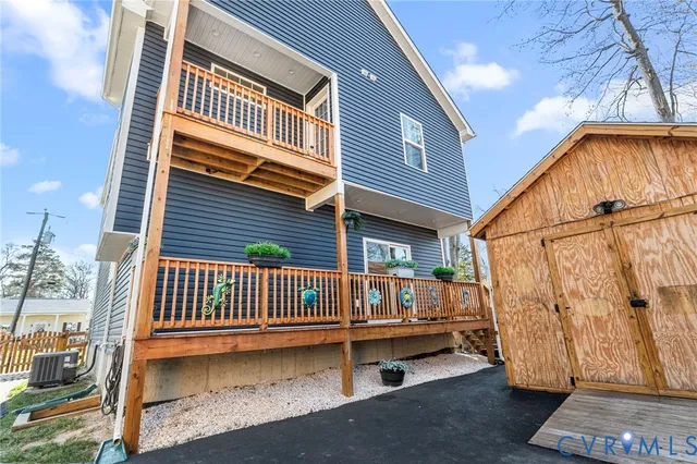 a view of a house with a small deck