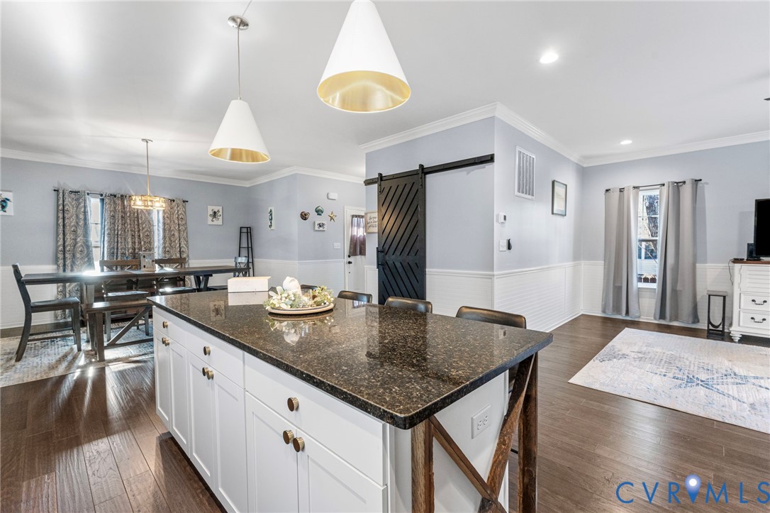 123 8th Street Colonial Beach, VA 22443 - Photo 10 of 36 a kitchen with stainless steel appliances granite countertop a sink a stove and a refrigerator
