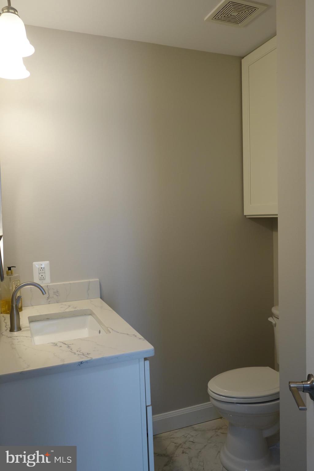 8196 Tenbrook Drive Gainesville, VA 20155 - Photo 12 of 51 a bathroom with a sink and a toilet