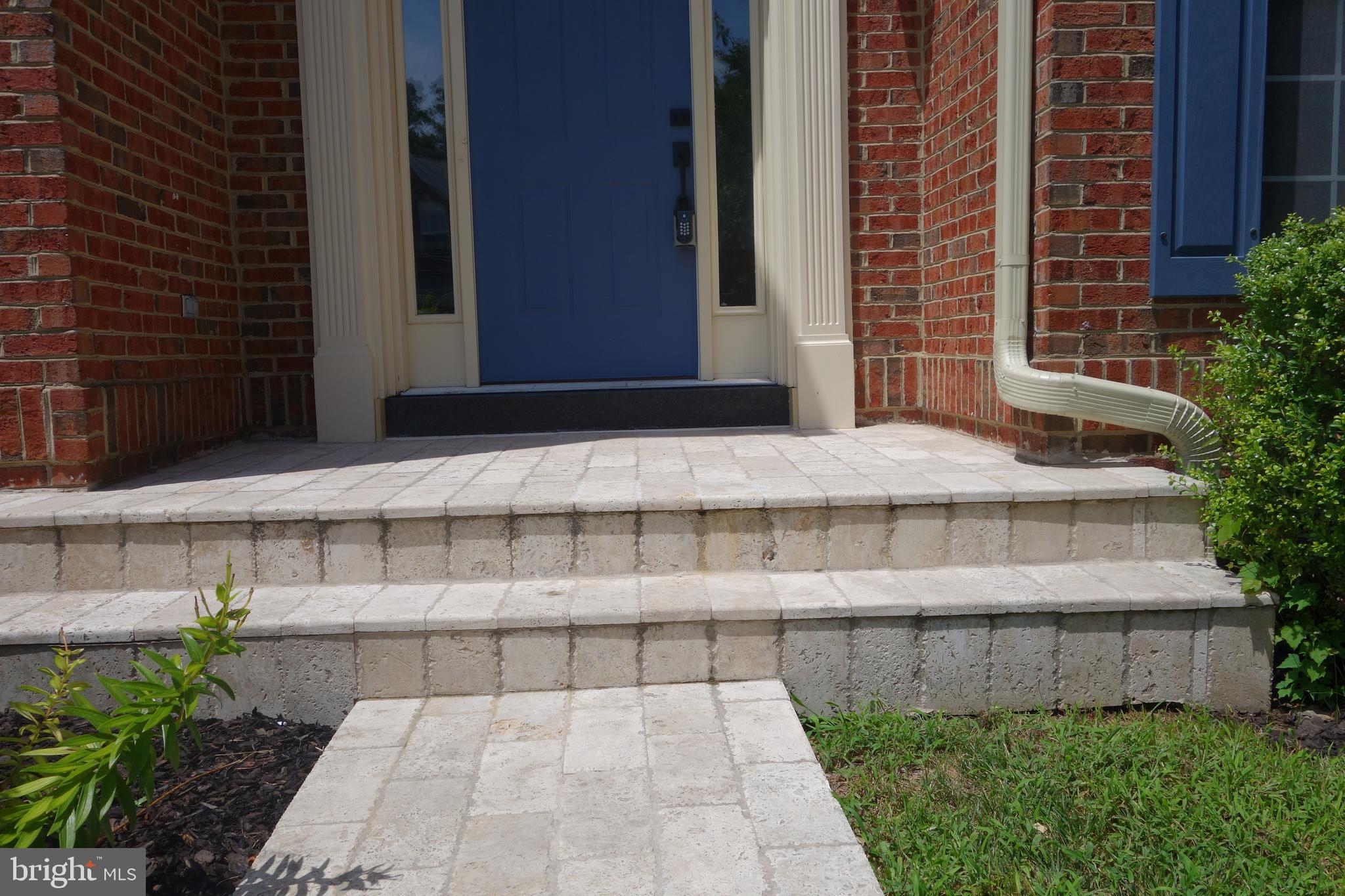 8196 Tenbrook Drive Gainesville, VA 20155 - Photo 2 of 51 a view of a brick building with many windows