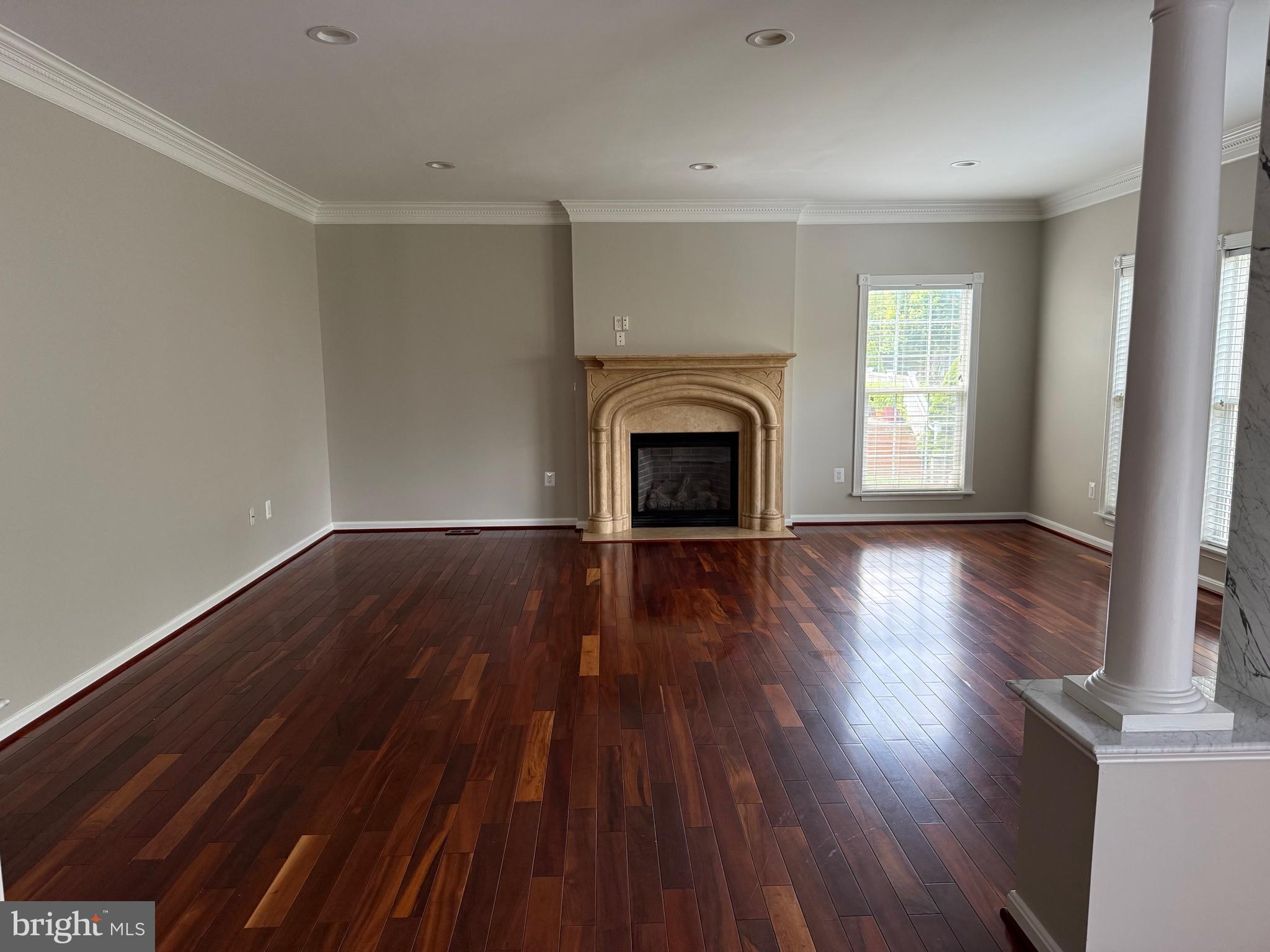 8196 Tenbrook Drive Gainesville, VA 20155 - Photo 23 of 51 a view of an empty room with wooden floor and a window