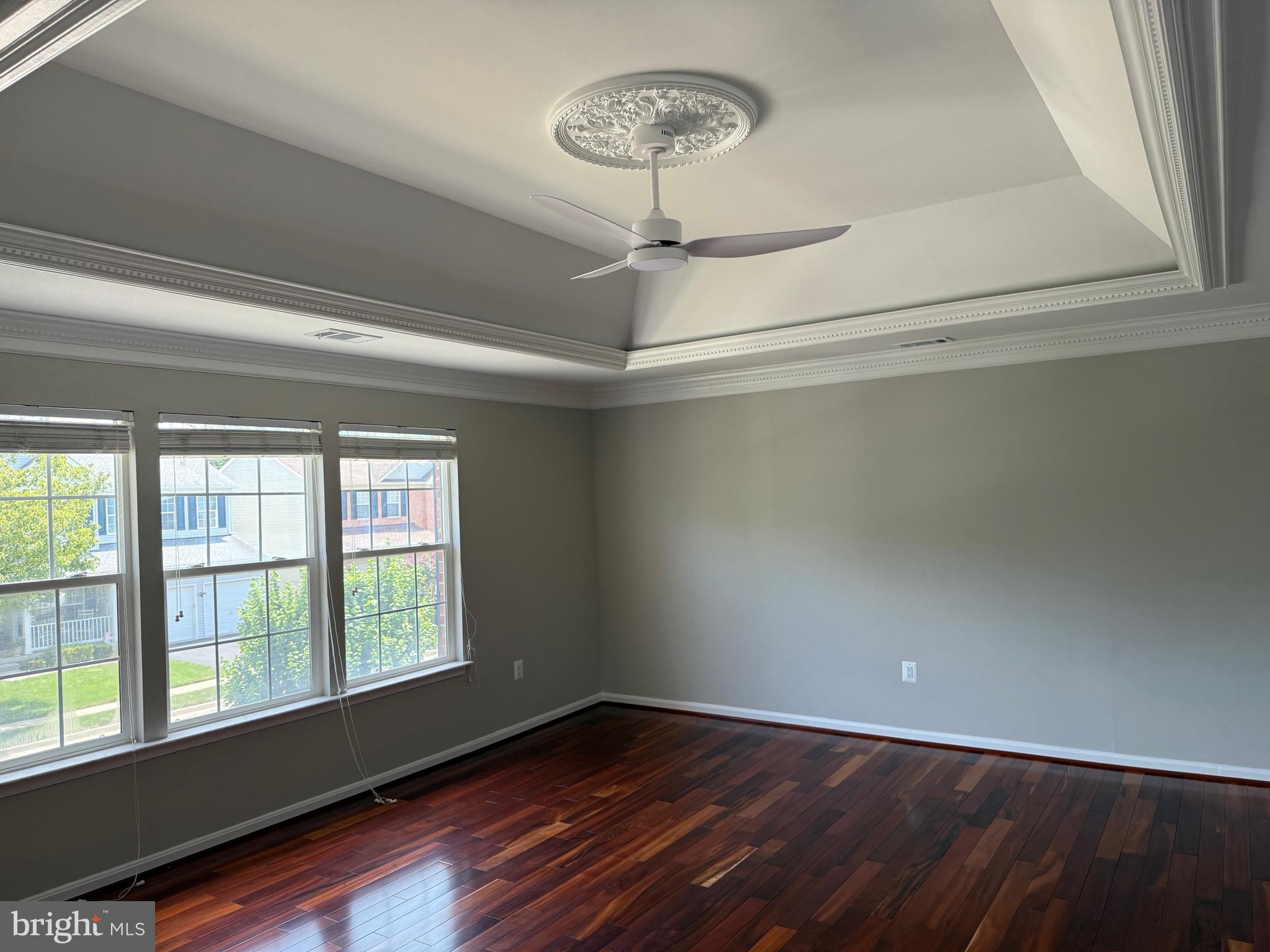 8196 Tenbrook Drive Gainesville, VA 20155 - Photo 25 of 51 a view of an empty room with wooden floor and a window
