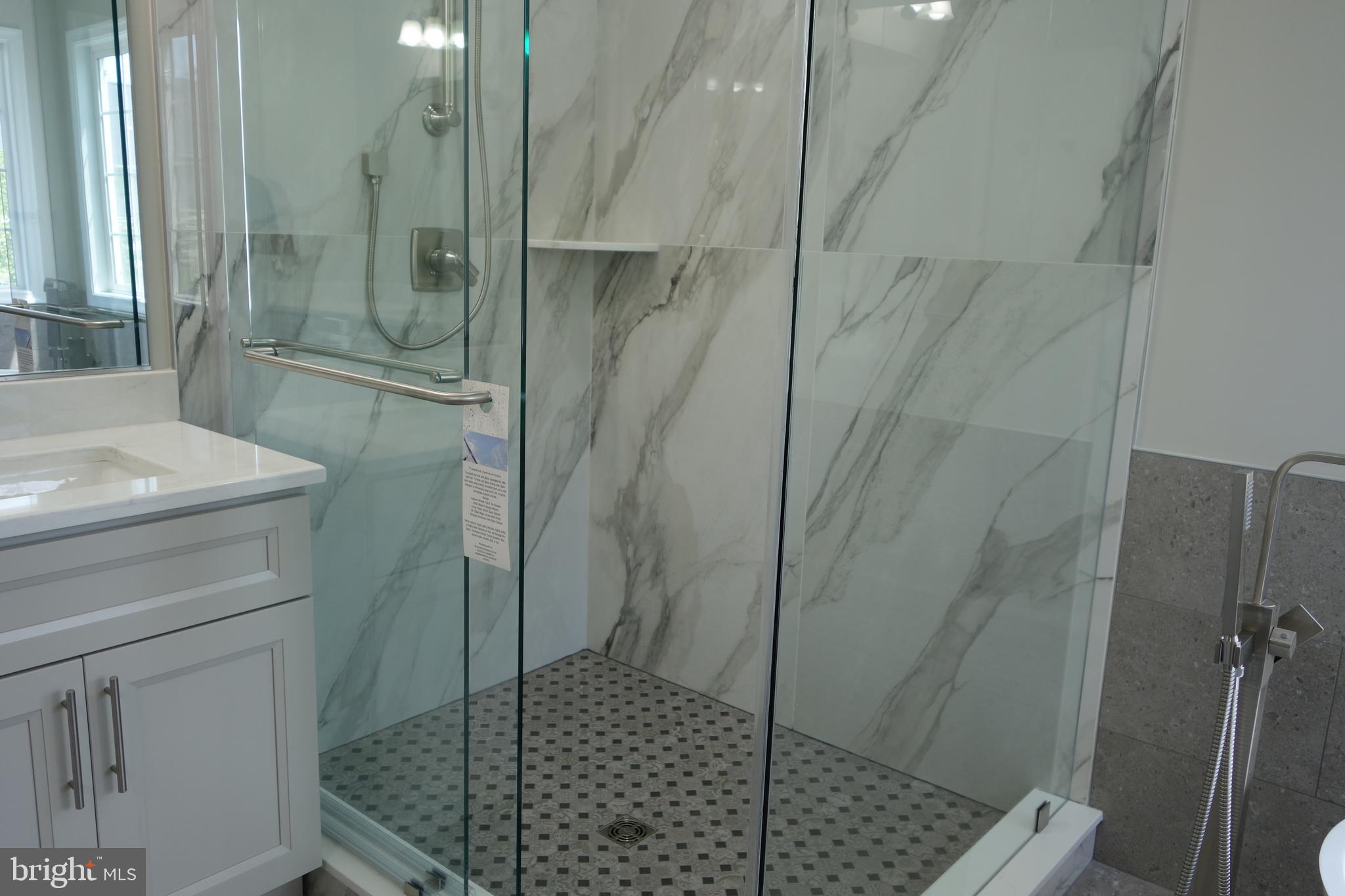 8196 Tenbrook Drive Gainesville, VA 20155 - Photo 31 of 51 a bathroom with a shower and toilet