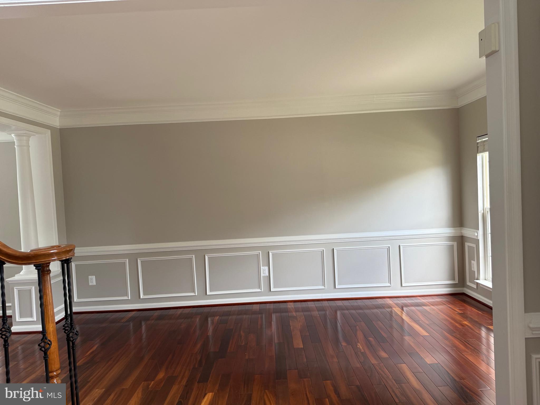 8196 Tenbrook Drive Gainesville, VA 20155 - Photo 5 of 51 a view of an empty room with wooden floor and a window