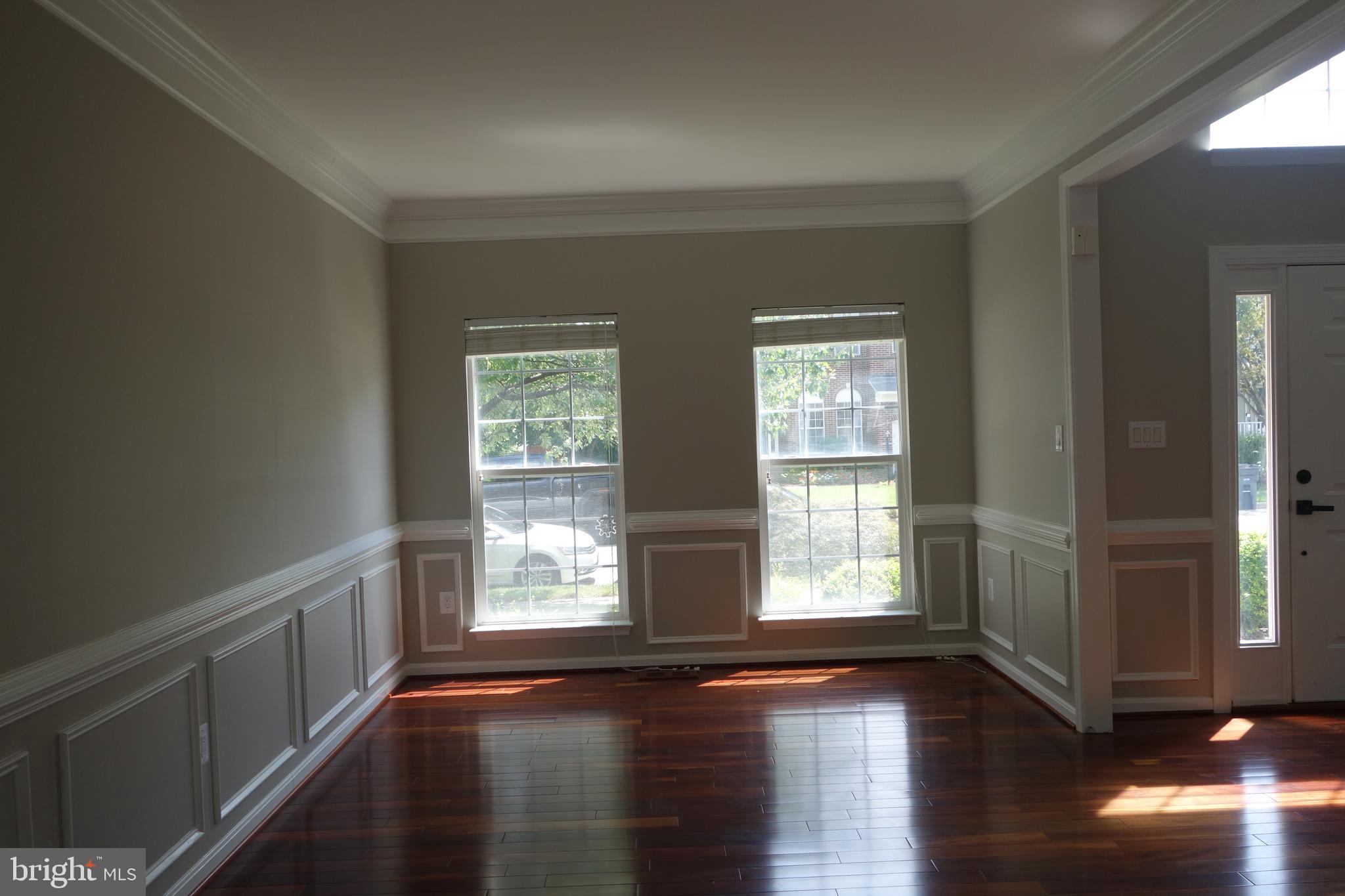 8196 Tenbrook Drive Gainesville, VA 20155 - Photo 6 of 51 a view of empty room with wooden floor and fan