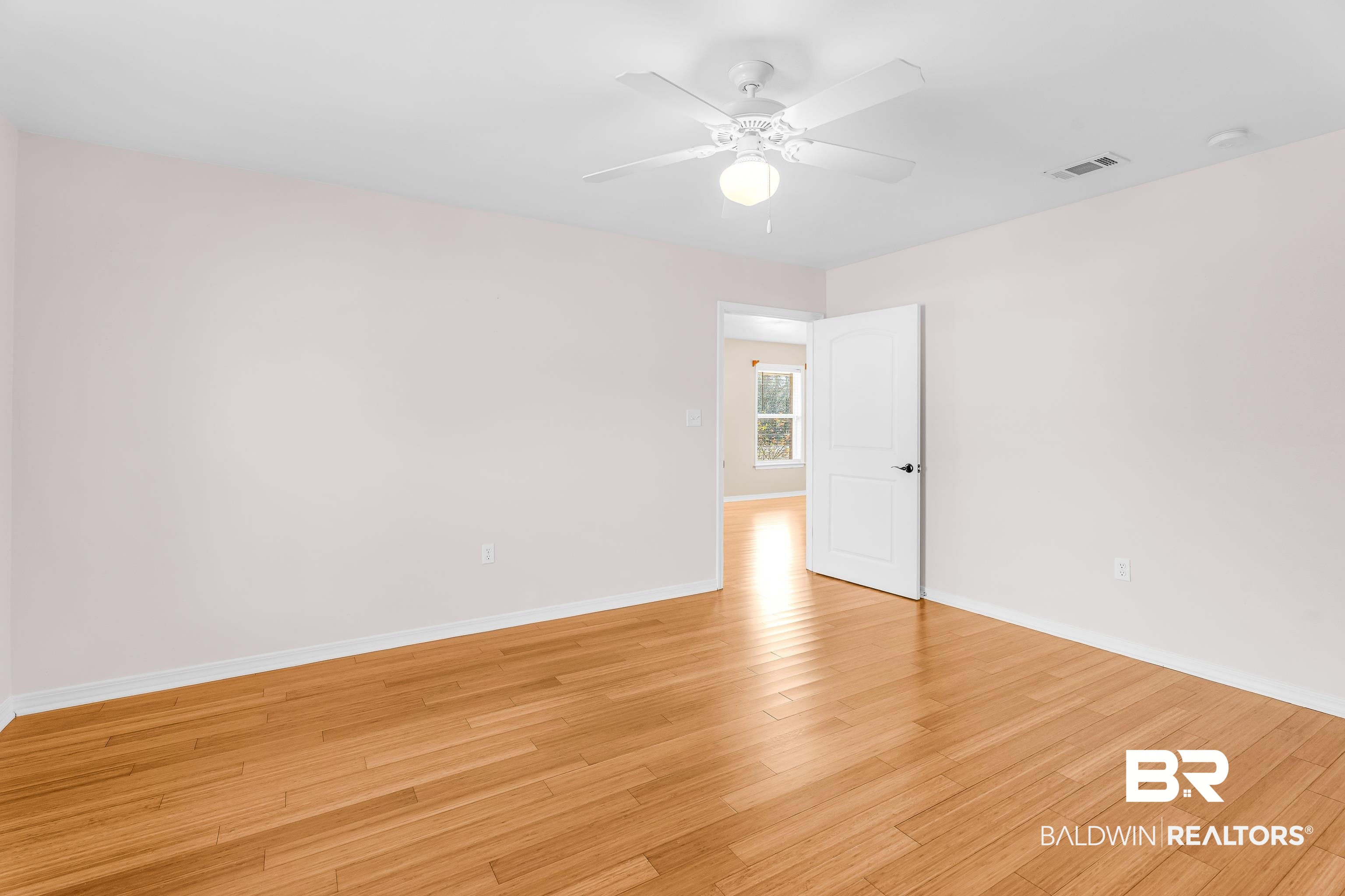 22095 8th Street Silverhill, AL 36576 - Photo 41 of 42 Spare room with a ceiling fan and light wood-type flooring