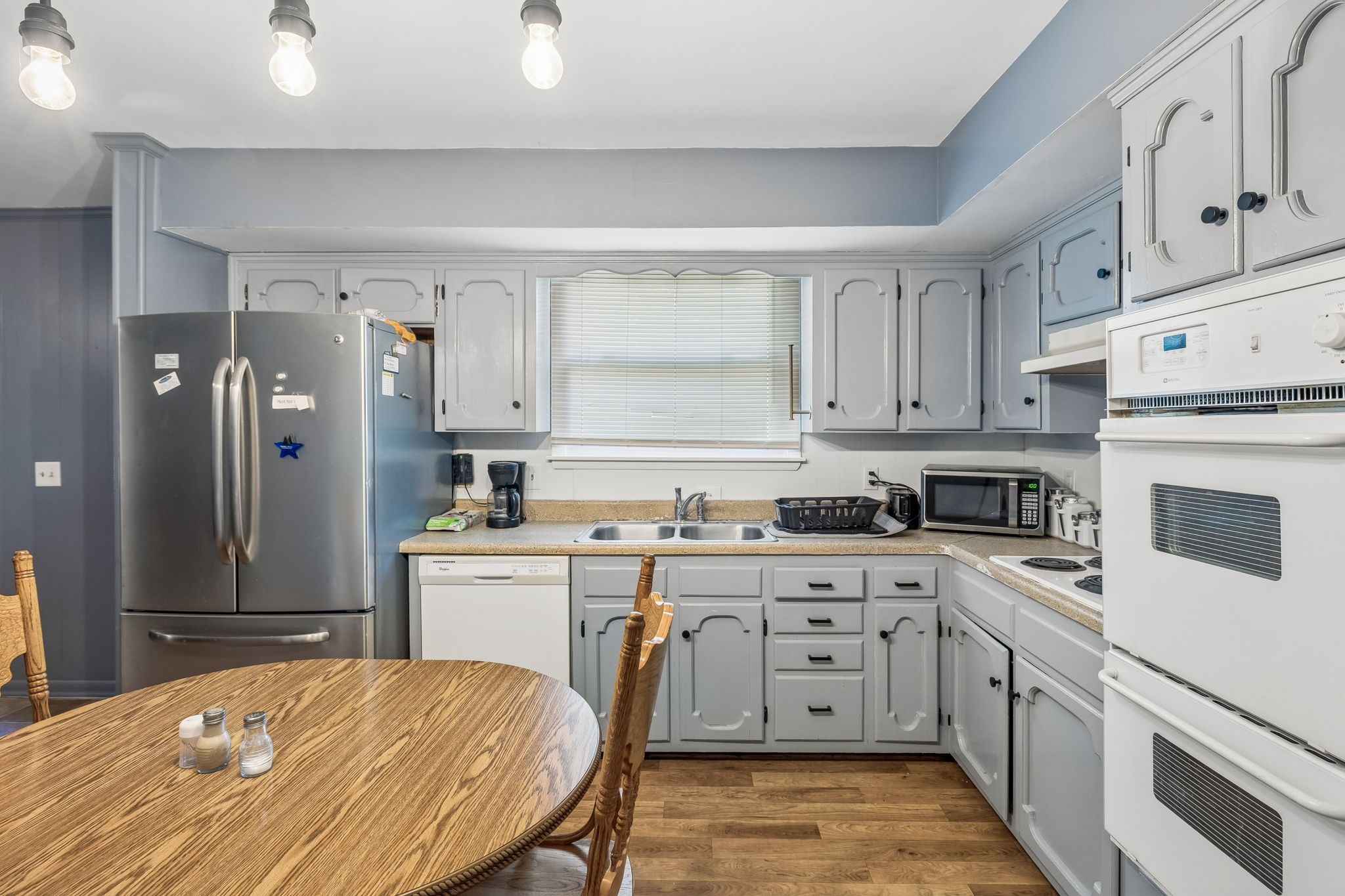 1246 Apache Lane Madison, TN 37115 - Photo 8 of 21 a kitchen with white cabinets and white appliances