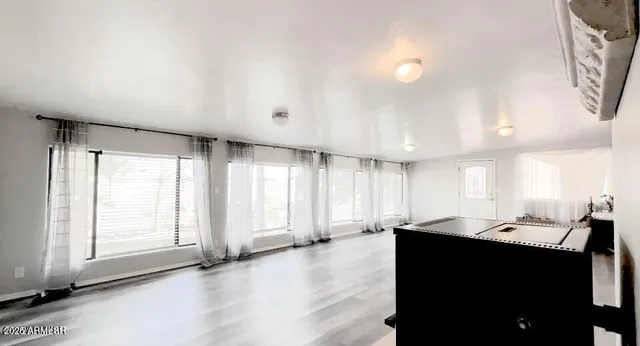 a view of a kitchen with a sink and a window