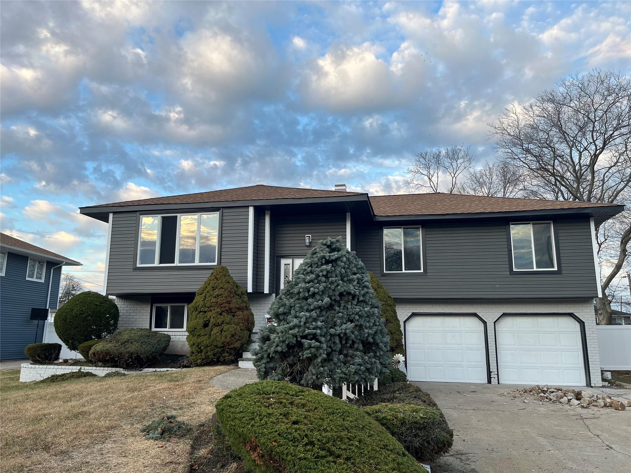a front view of a house with garden