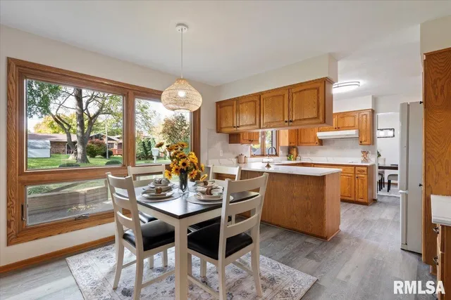 a view of a dining room with furniture window and outside view