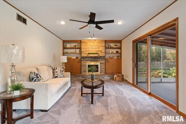 a living room with furniture and a fireplace