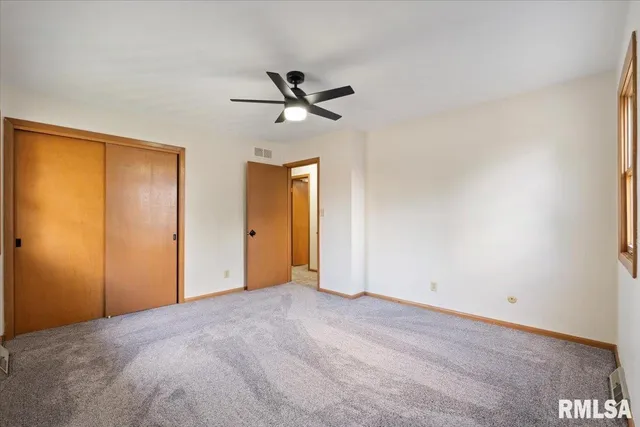 a view of an empty room and a window