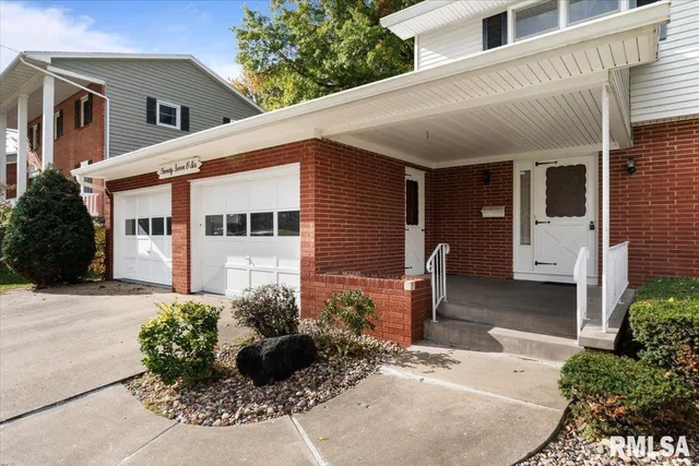 a view of a house with a door and a window