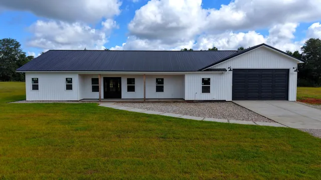 a house view with a garden space