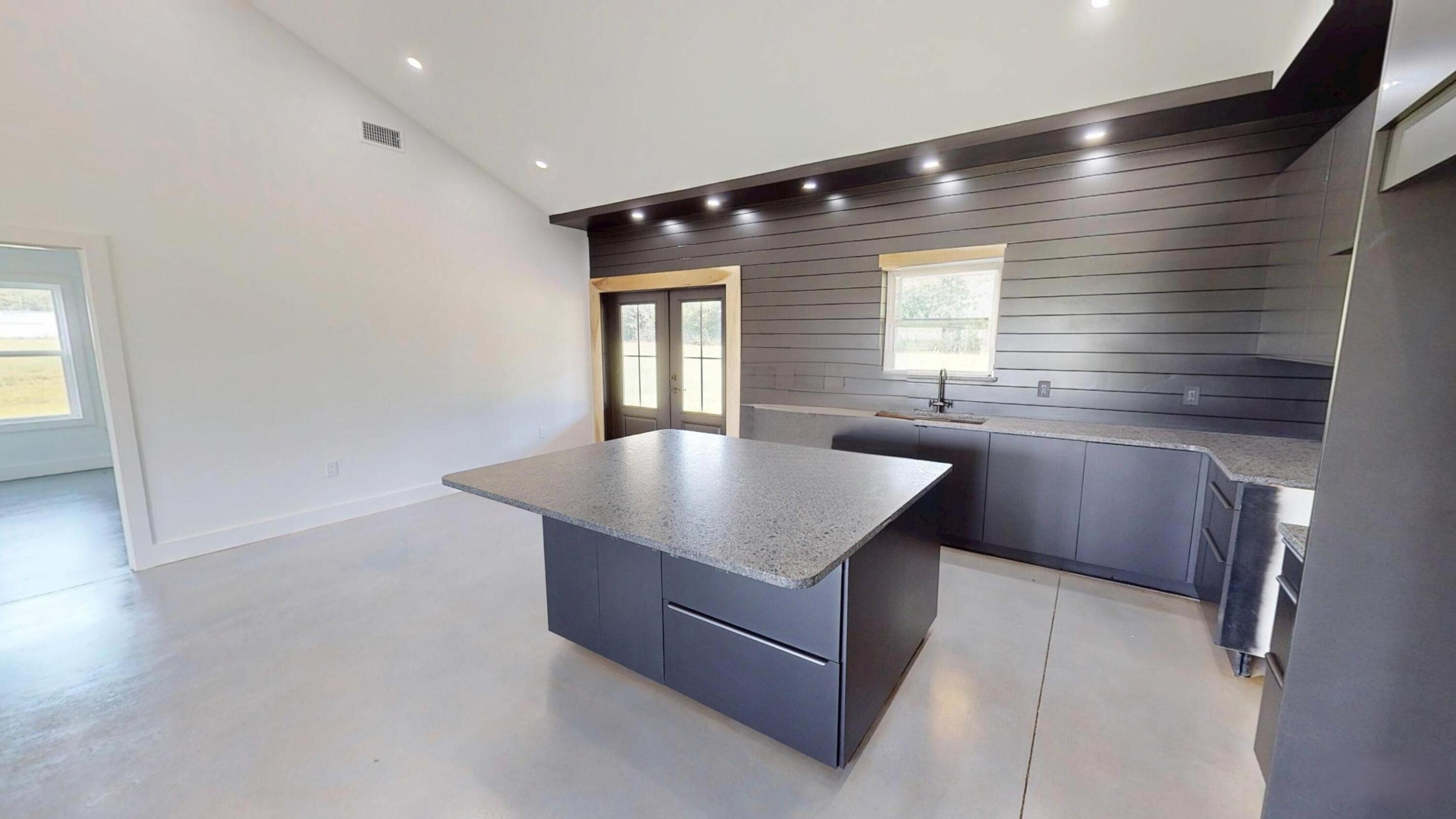 37837 Straughn School Road Andalusia, AL 36421 - Photo 15 of 30 a kitchen with stainless steel appliances granite countertop a sink and a granite counter tops