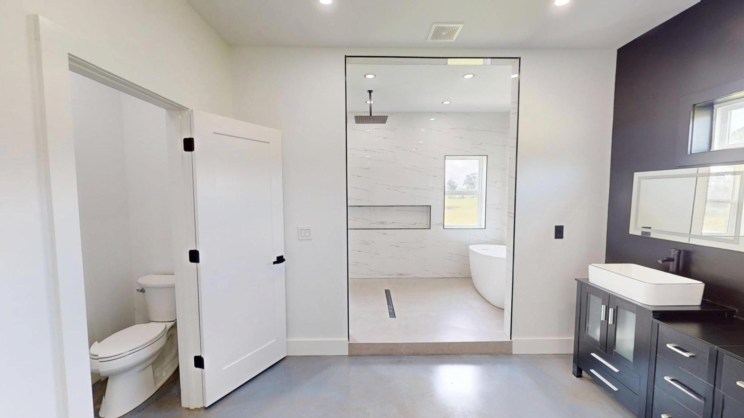 37837 Straughn School Road Andalusia, AL 36421 - Photo 18 of 30 a bathroom with a toilet sink and shower