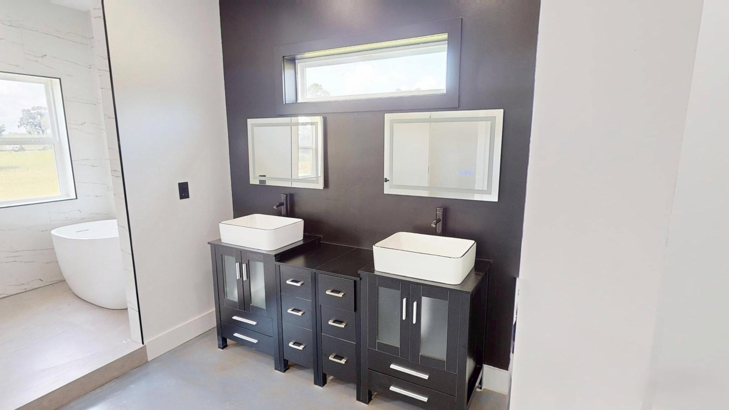 37837 Straughn School Road Andalusia, AL 36421 - Photo 19 of 30 a bathroom with a toilet a sink a window and mirror