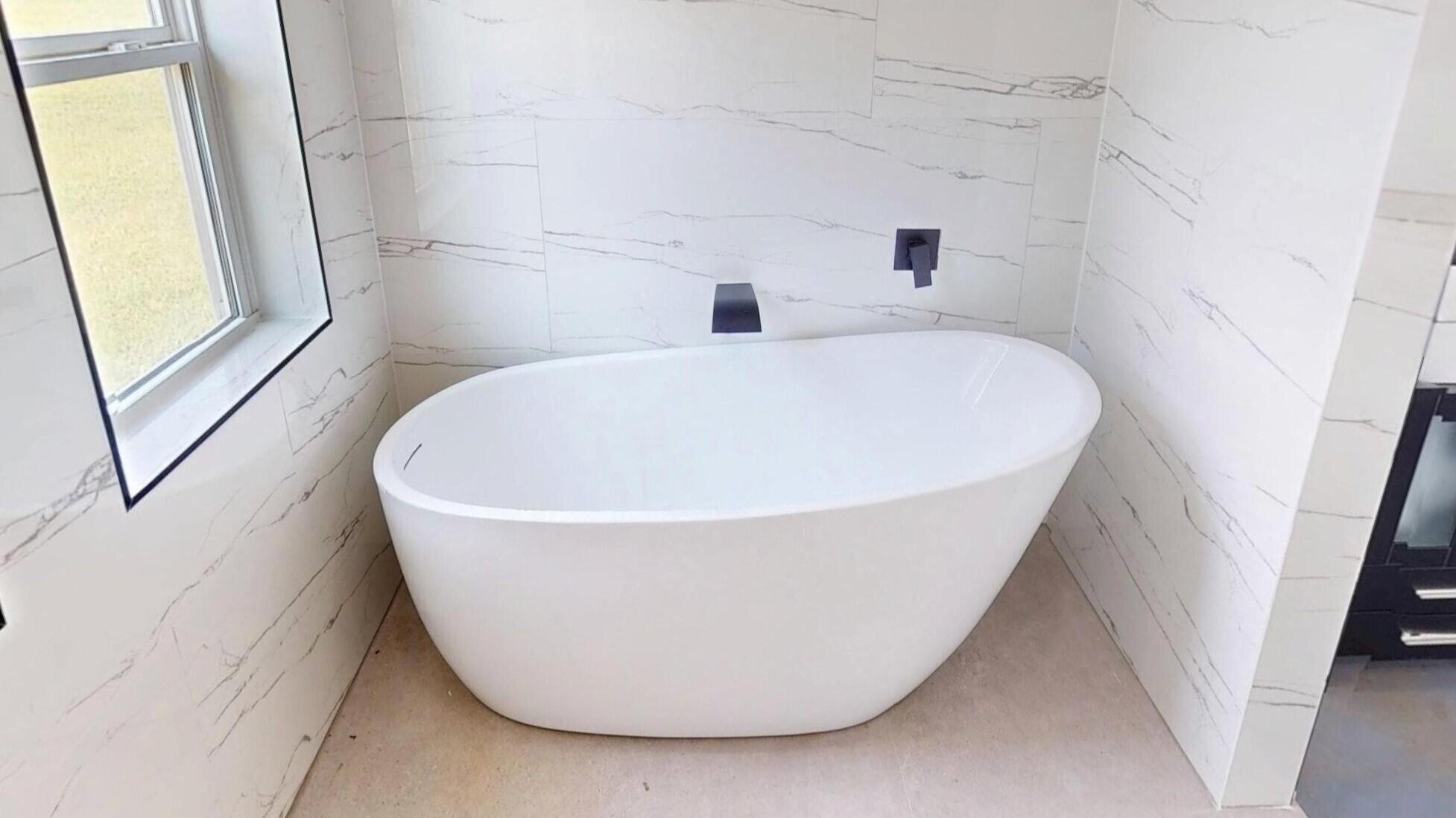 37837 Straughn School Road Andalusia, AL 36421 - Photo 20 of 30 a white bath tub sitting in a bathroom