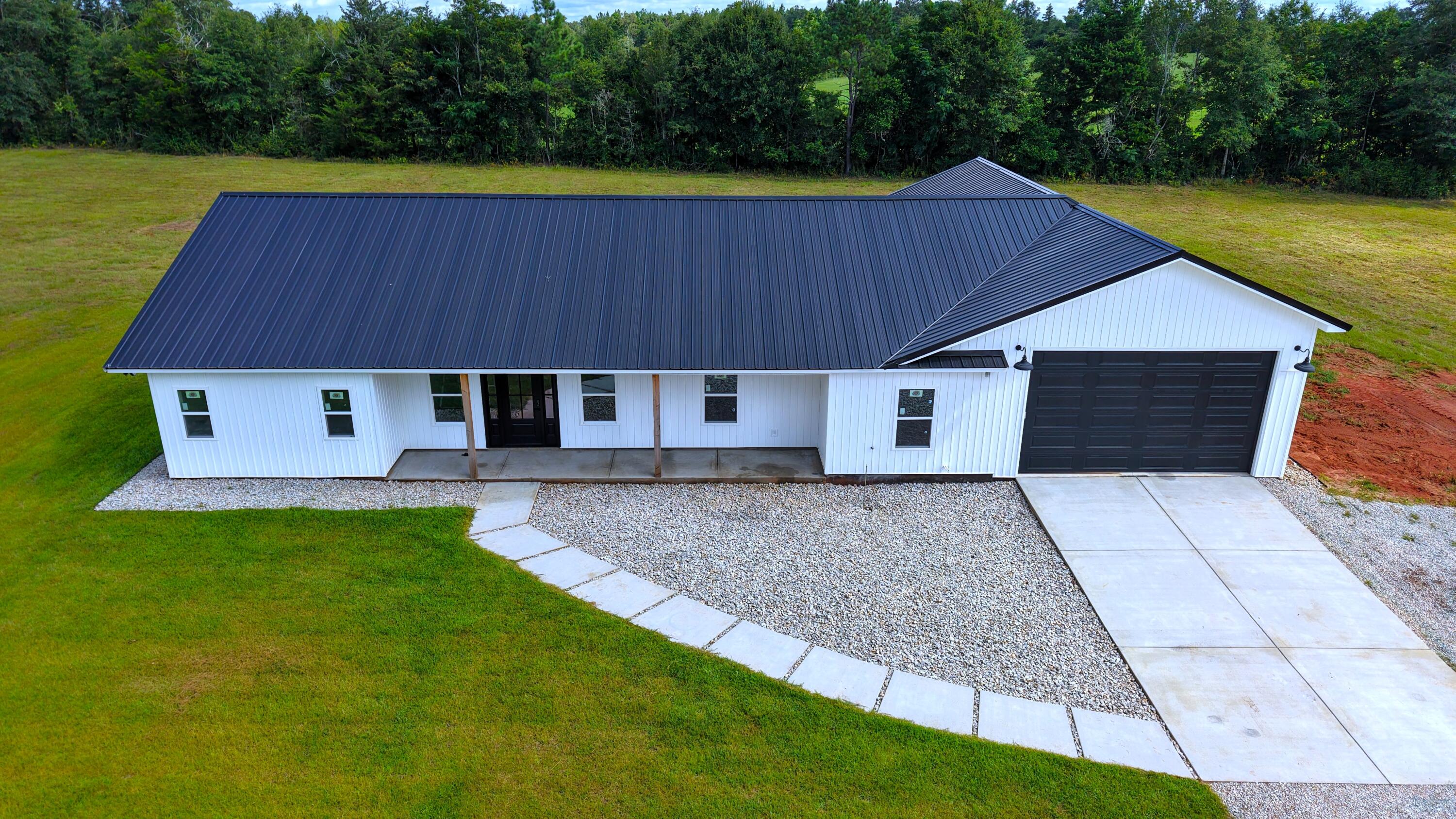 37837 Straughn School Road Andalusia, AL 36421 - Photo 2 of 30 a front view of house with yard and trees in the background