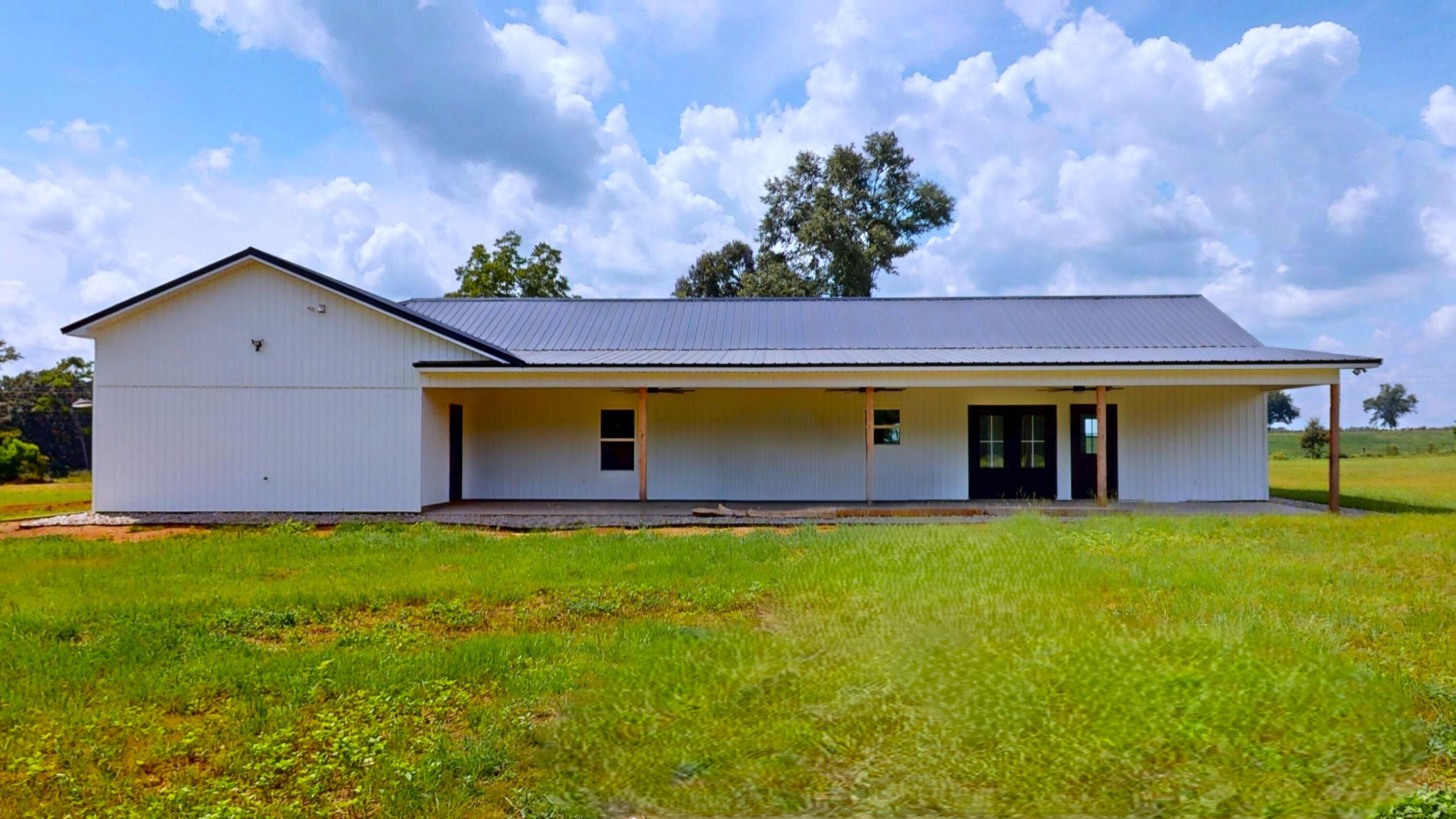 37837 Straughn School Road Andalusia, AL 36421 - Photo 25 of 30 a front view of house with yard and trees in the background