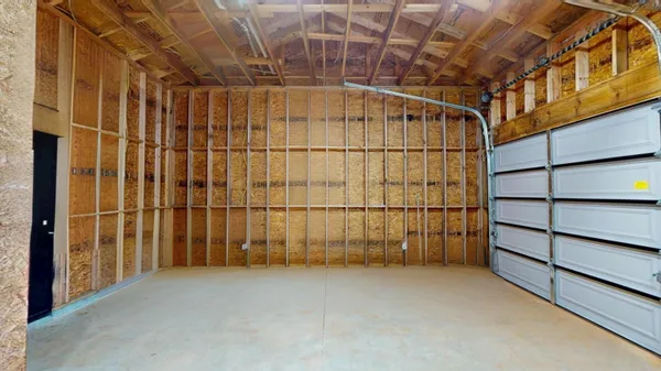 a view of an empty room with wooden walls