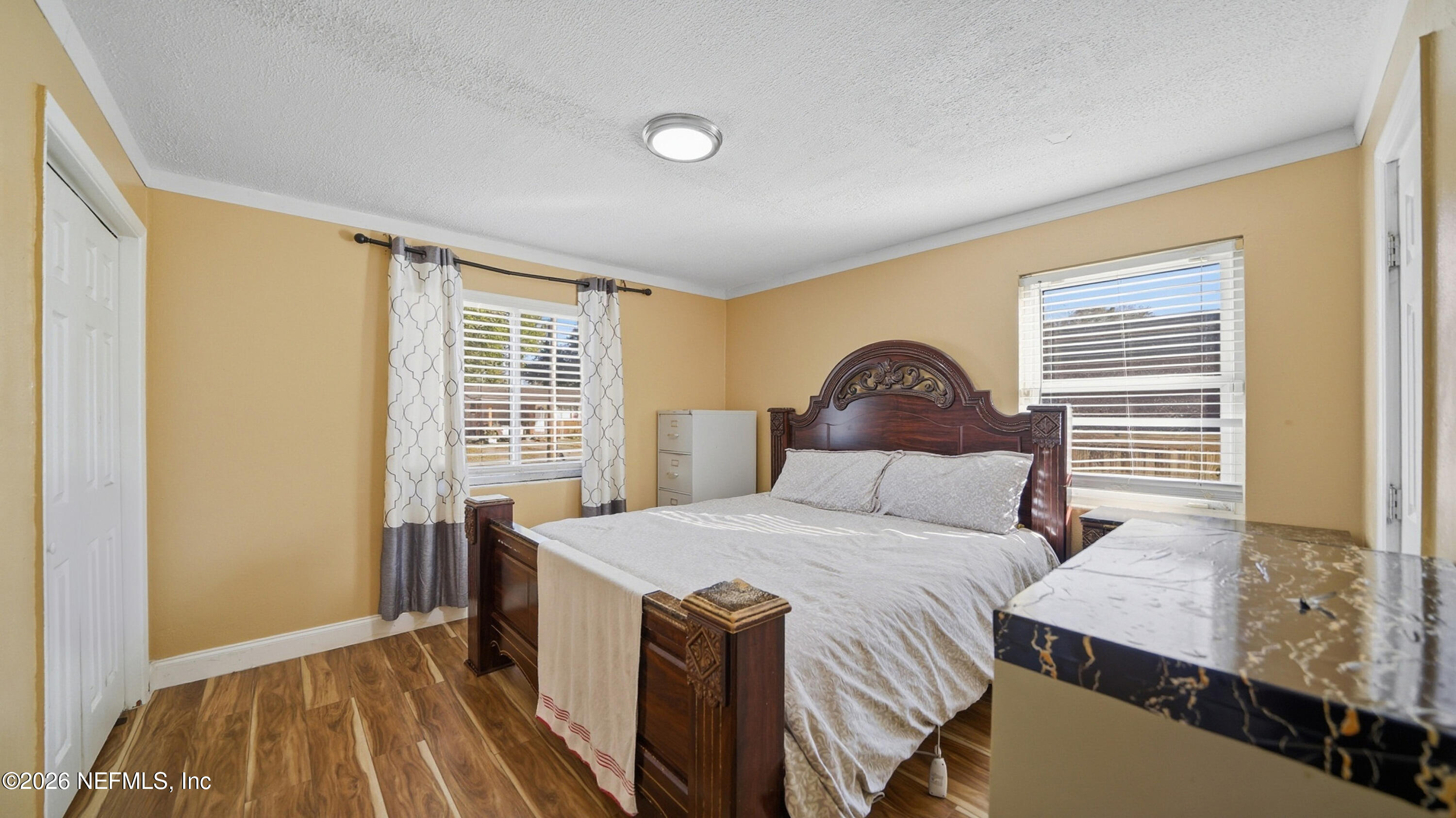 2238 Ligustrum Road Jacksonville, FL 32211 - Photo 15 of 31 a bedroom with a bed and a window
