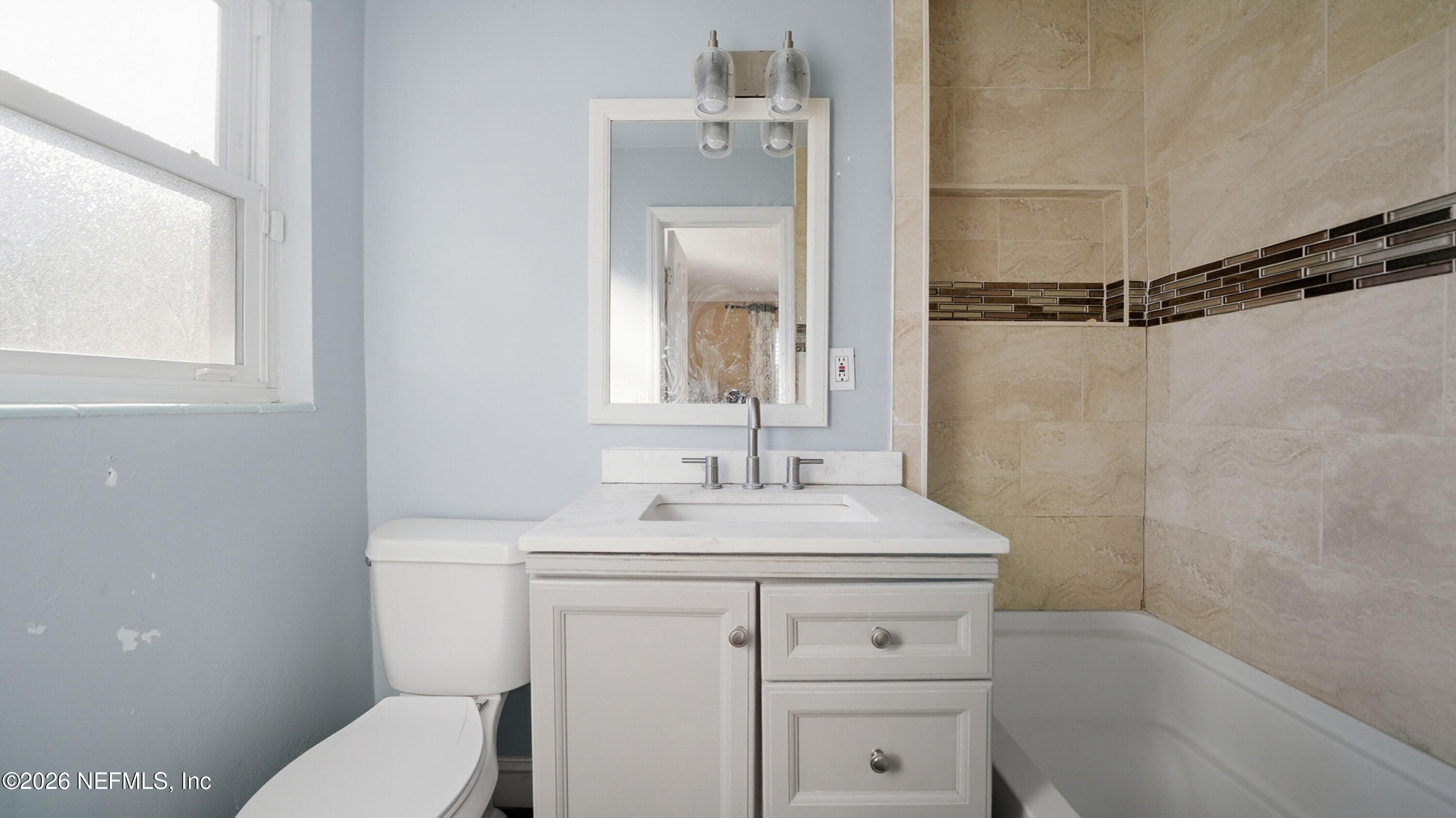 2238 Ligustrum Road Jacksonville, FL 32211 - Photo 17 of 31 a bathroom with a sink a toilet and shower