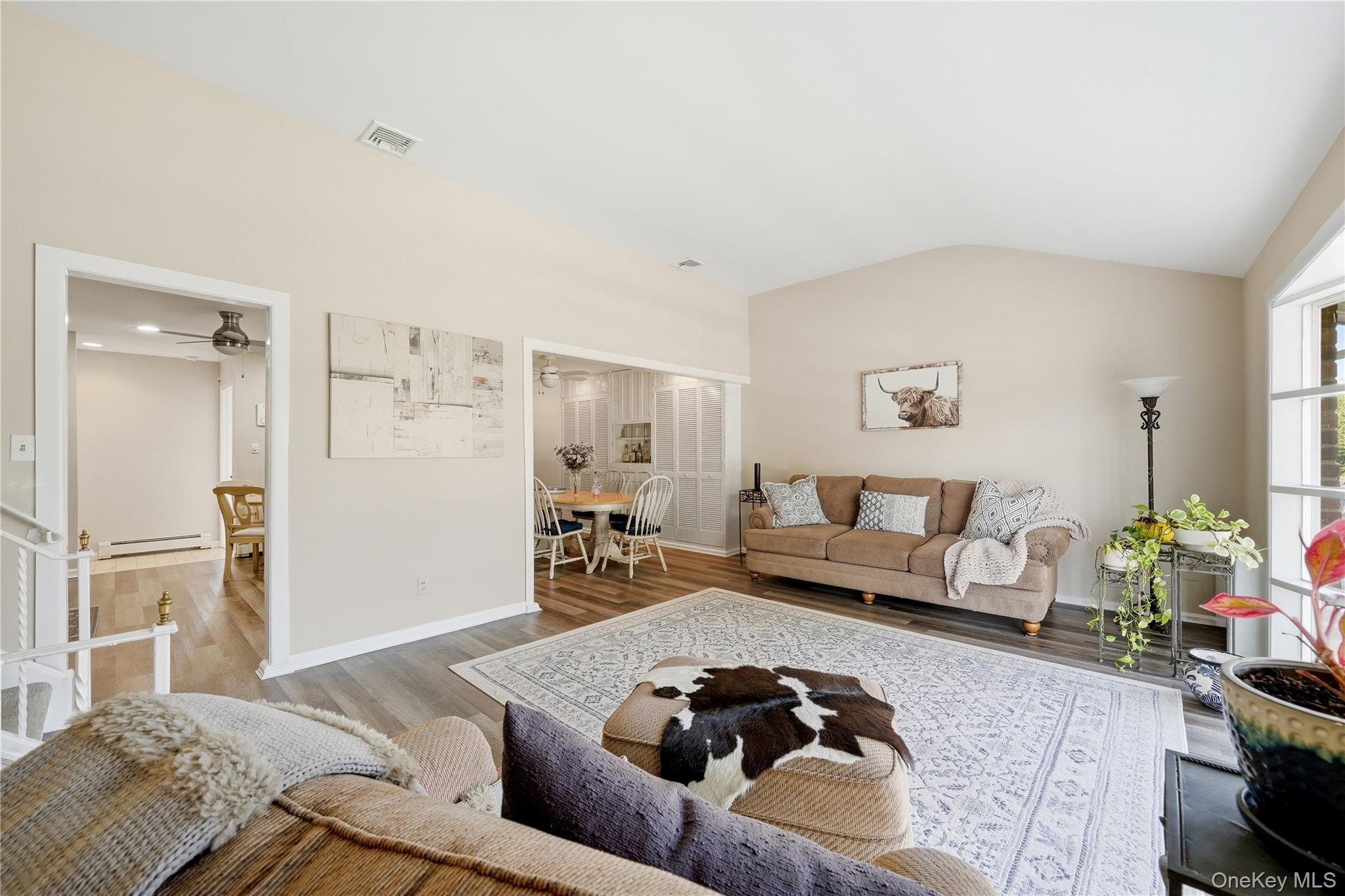 1853 Decatur Avenue Merrick, NY 11566 - Photo 6 of 43 a living room with furniture and a couch