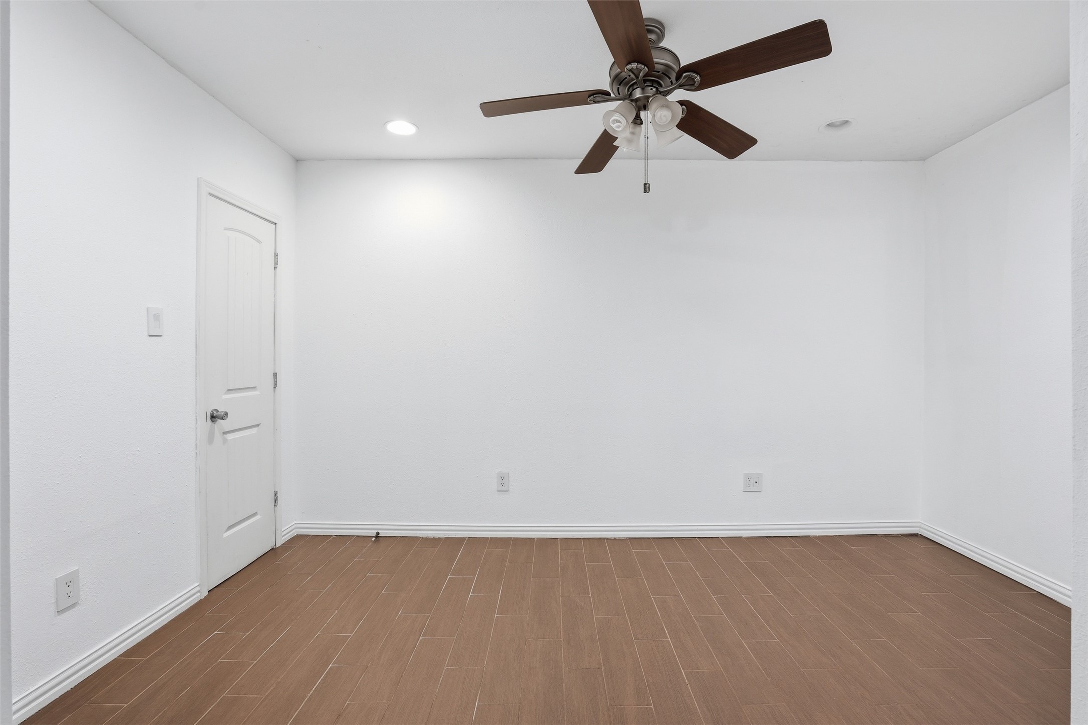 2605 Burke Road Pasadena, TX 77502 - Photo 16 of 29 an empty room with a fan and a ceiling fan