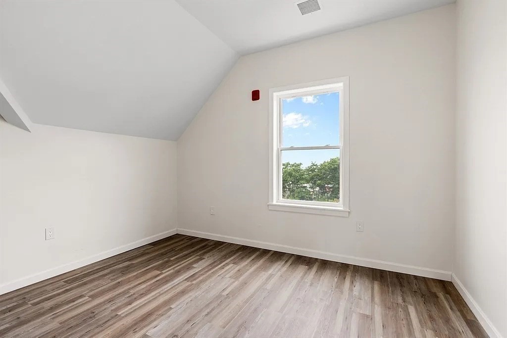 20 Graham Street, Unit 4 Gardner, MA 01440 - Photo 15 of 23 an empty room with wooden floor and windows