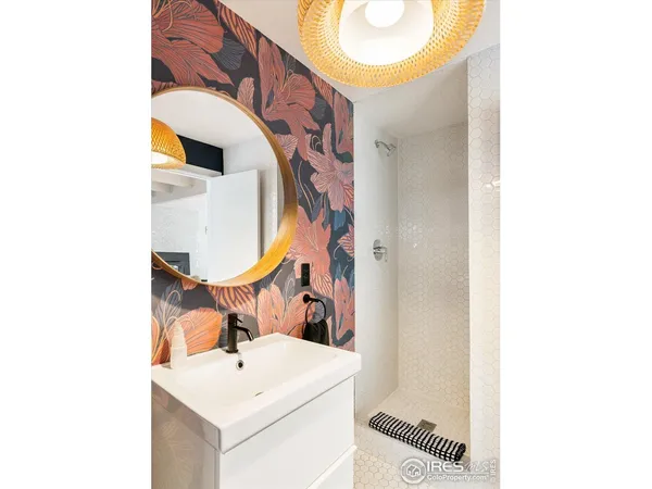 a bathroom with a sink and mirror