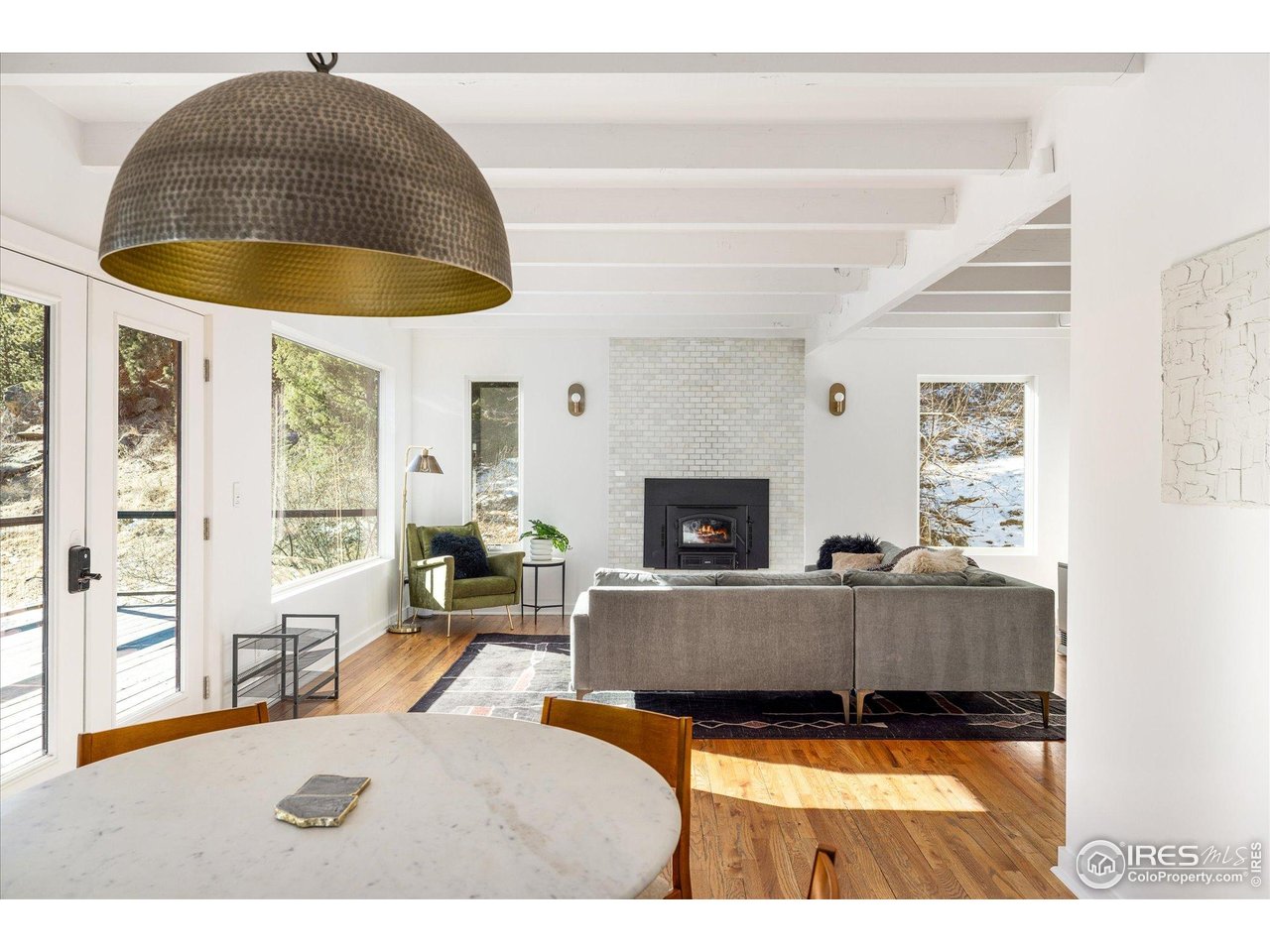 781 Cold Springs Road Boulder, CO 80302 - Photo 2 of 36 a living room with furniture and a fireplace