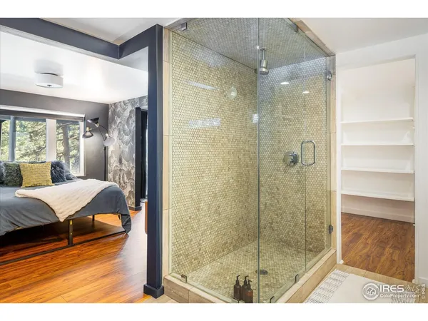 a bathroom with a tub and shower