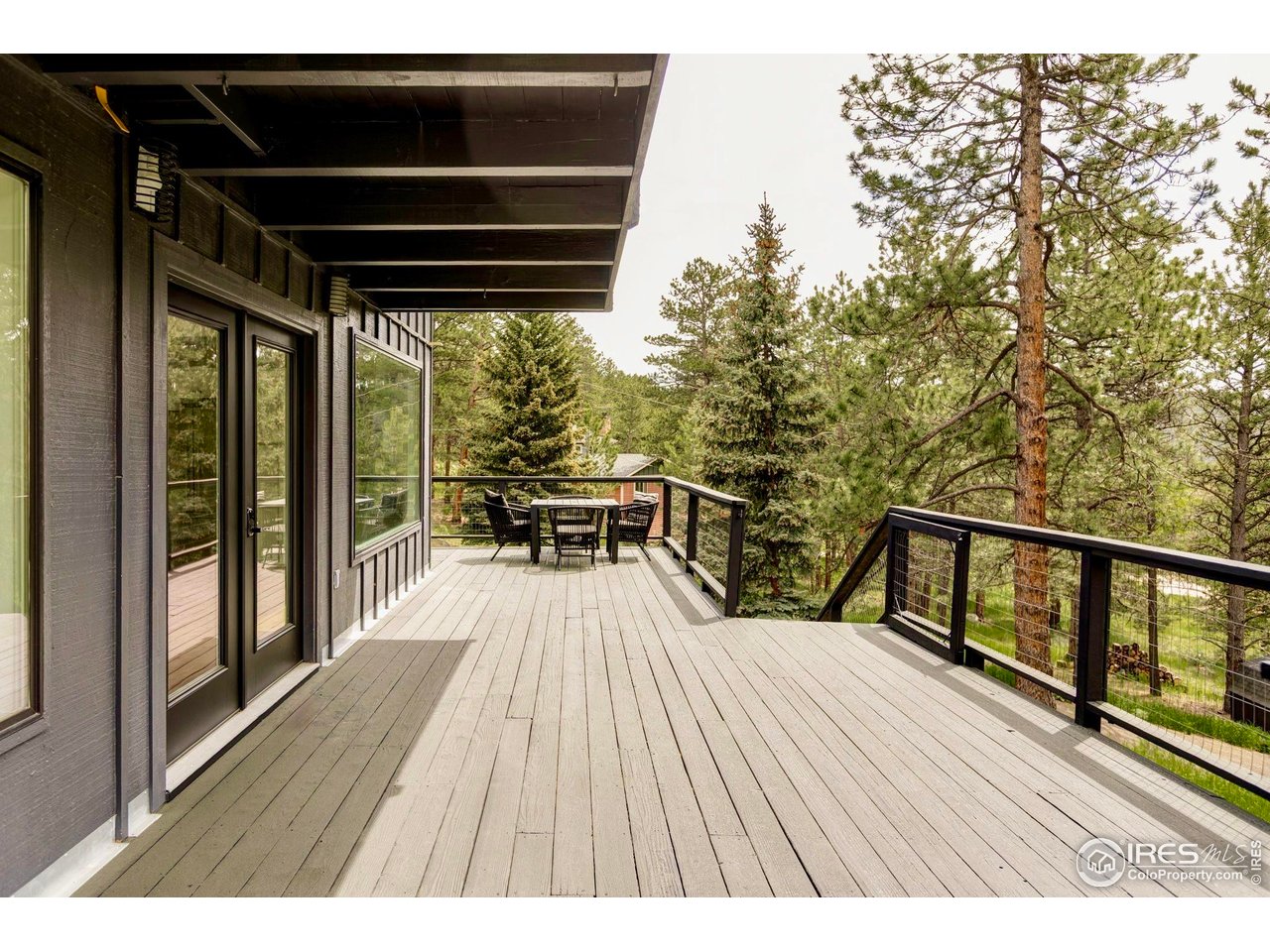 781 Cold Springs Road Boulder, CO 80302 - Photo 29 of 36 a view of balcony with wooden floor and seating space
