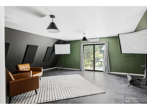 a bedroom with a bed and mirror