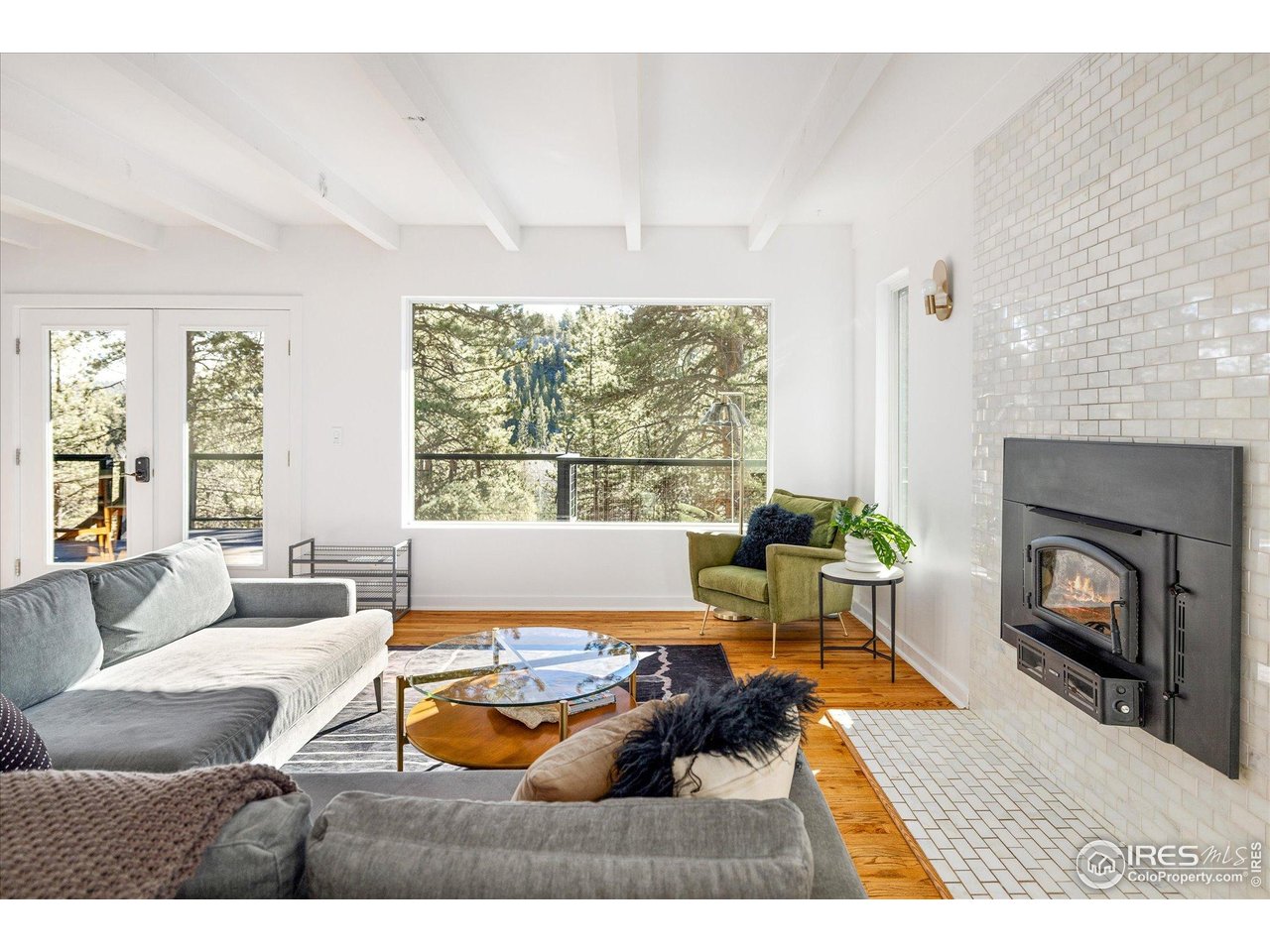 781 Cold Springs Road Boulder, CO 80302 - Photo 8 of 36 a living room with furniture and a fireplace