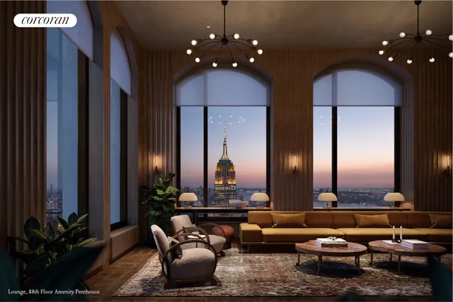 a living room with couches and painted walls with a mirror