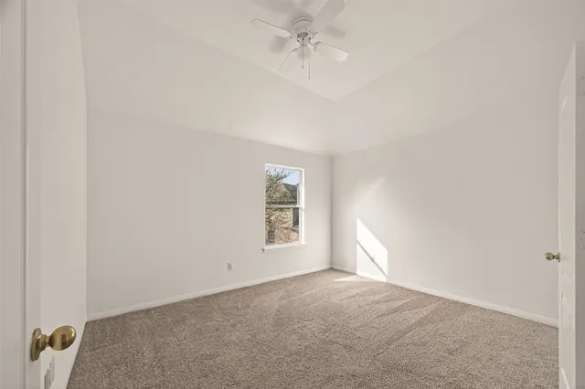 a view of a house with a big yard and potted plants