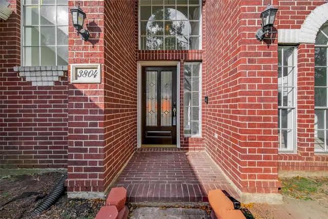 a view of a brick building with many windows