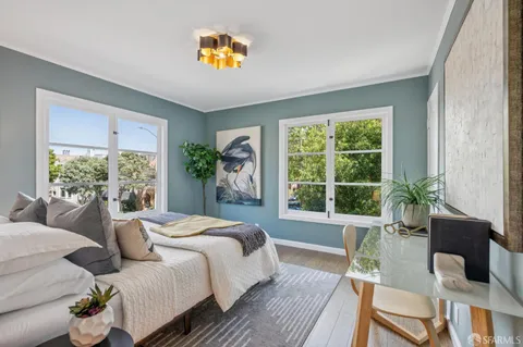 a bedroom with a bed and a table