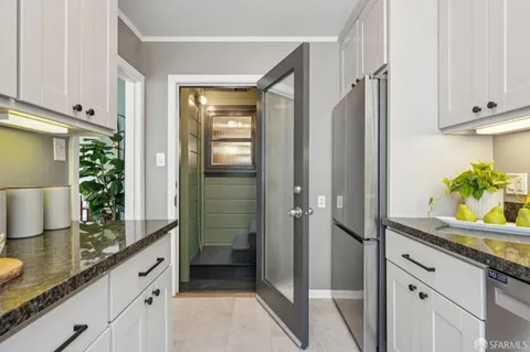 a view of a chairs and table in a patio