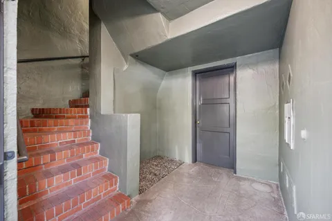 a view of a hallway with a chandelier