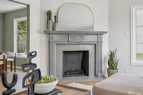 a view of a hallway with chandelier and a window