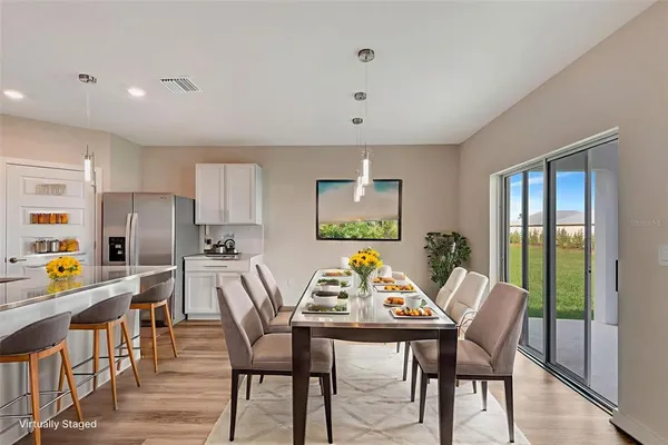 a view of a kitchen with wooden floor