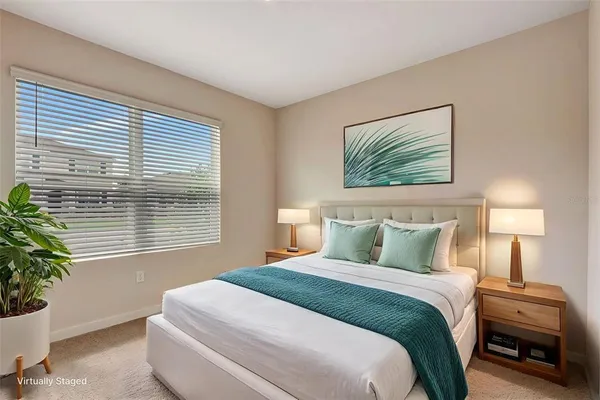 a bedroom with a bed and a flat screen television