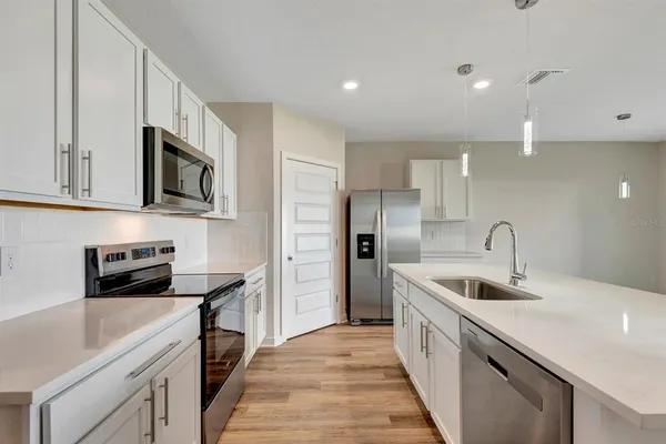 a kitchen with sink and window