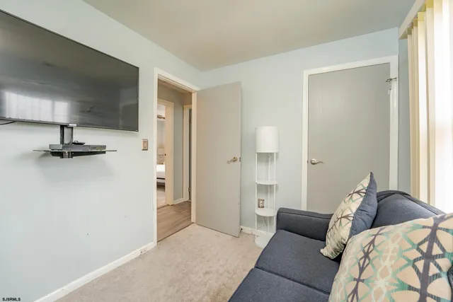 a bedroom with a bed and a table