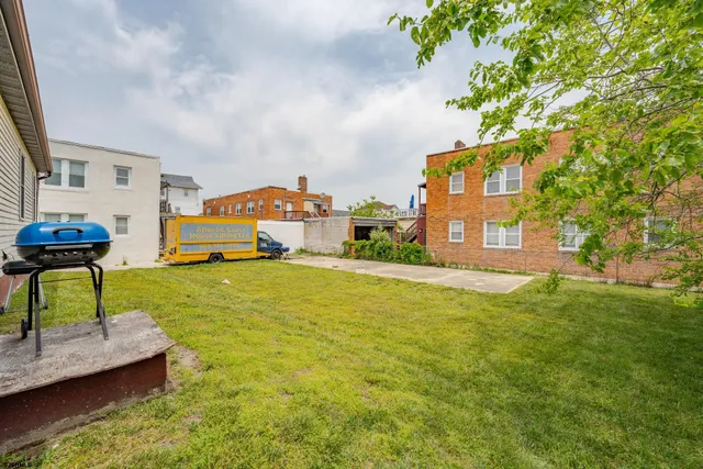 a view of a backyard of the house