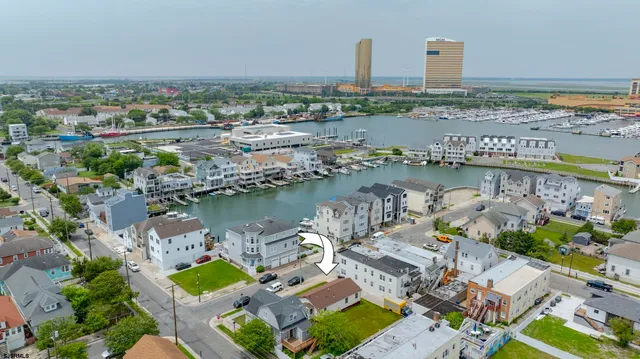 an aerial view of a city with a lake view