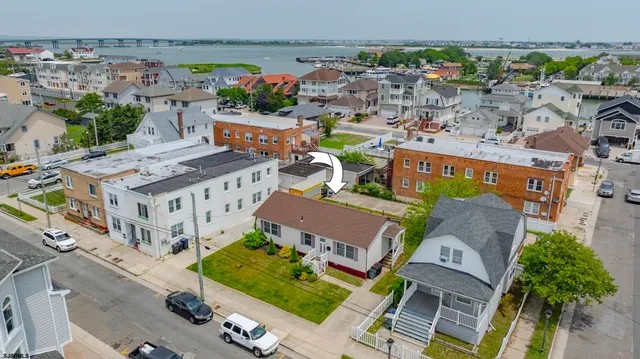 an aerial view of a city with lawn chairs and large trees